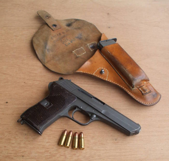 CZ-52 or ČZ vzor 52 pistol with holster and 7.62x25mm ammunition.