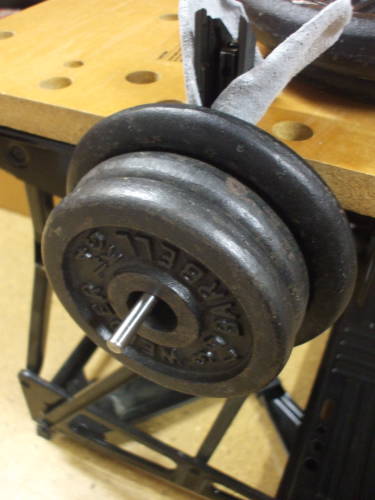 CZ-52 recoil spring being compressed by 11 pounds of weights.